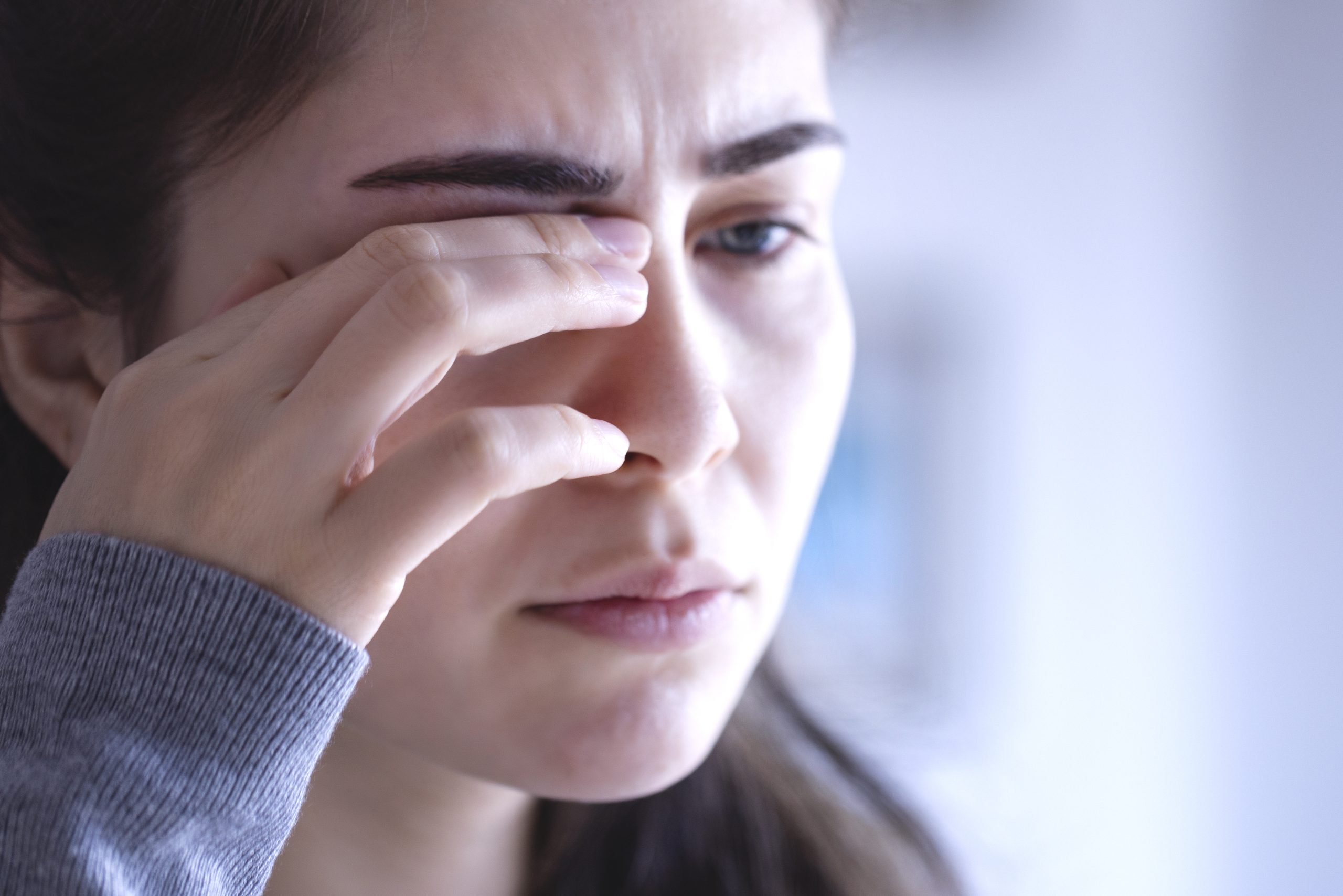 Eye Pain-Acanthamoeba Woman rubbing her eye