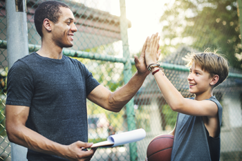 coachMentor350x233 Coach high-fiving a child