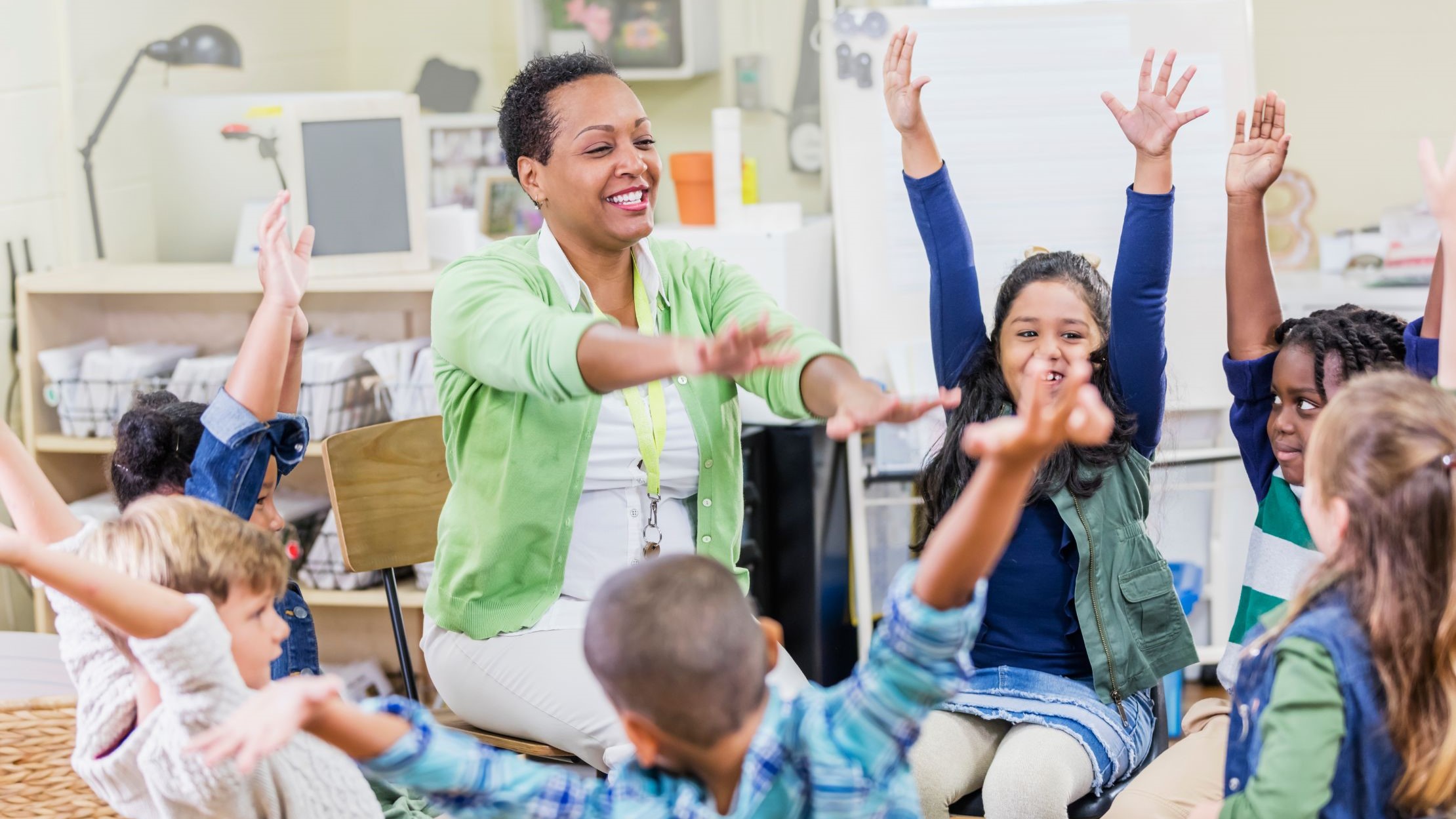 — title missing — Elementary school teacher doing physical activity with her class.