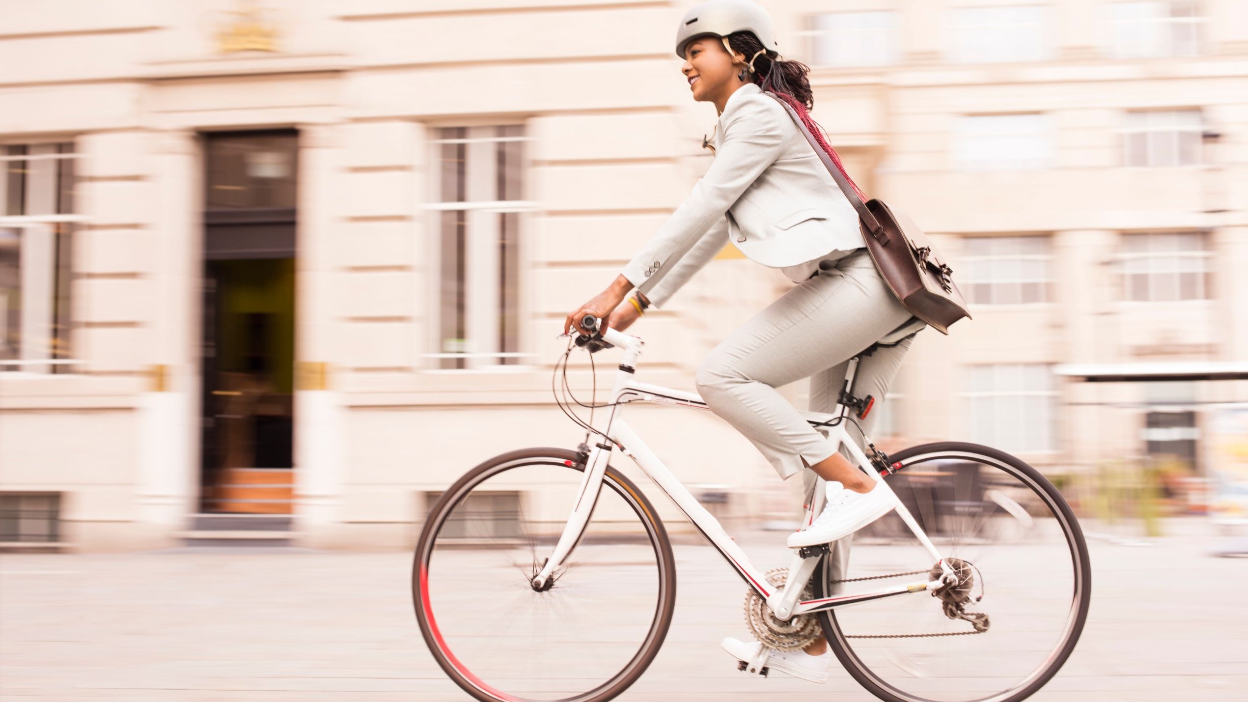 -- title missing -- Woman biking to work.