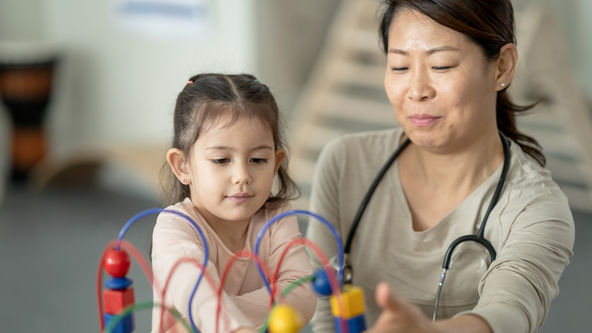 A doctor is monitoring a young child's development.