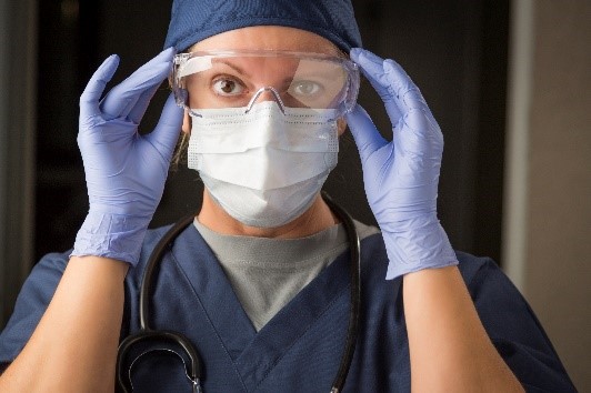 healthcare-personnel Healthcare worker in mask, gloves, and protective eyewear