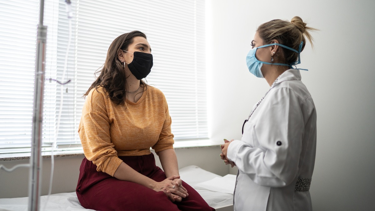 Woman with doctor a woman talking to her doctor
