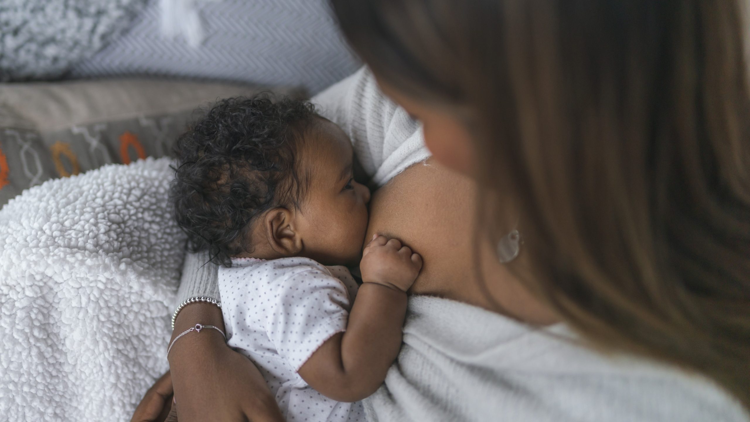 Breastfeedingnewborn169.jpg Woman breastfeeding a newborn.