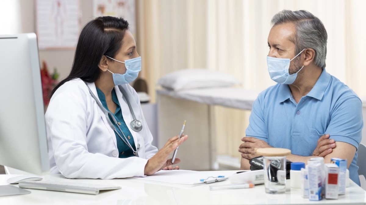 Doctor talking to patient a doctor explaining treatment to a patient