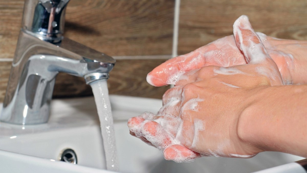 Wash hands a person washing his hands
