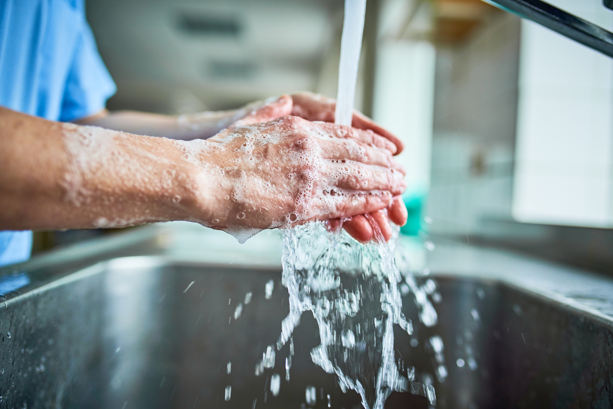 Invasive candidiasis can be prevented by practices such as hand washing and sanitizing A healthcare worker washing hands with soap