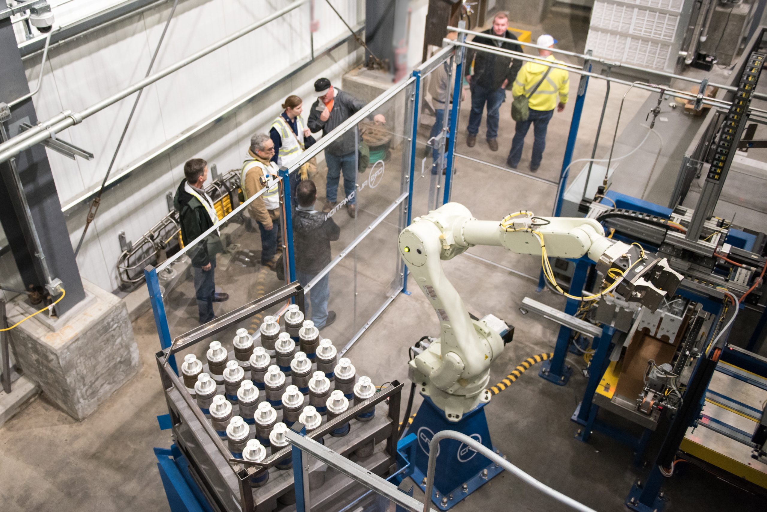 Review of automated equipment A group of inspectors in an industrial facility.