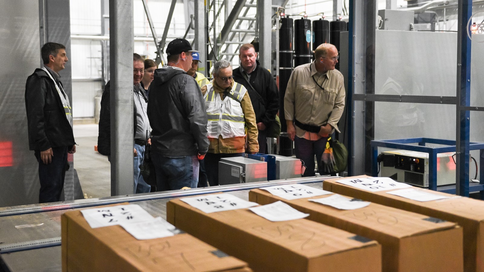 Review of SDC A group of inspectors in an industrial facility.