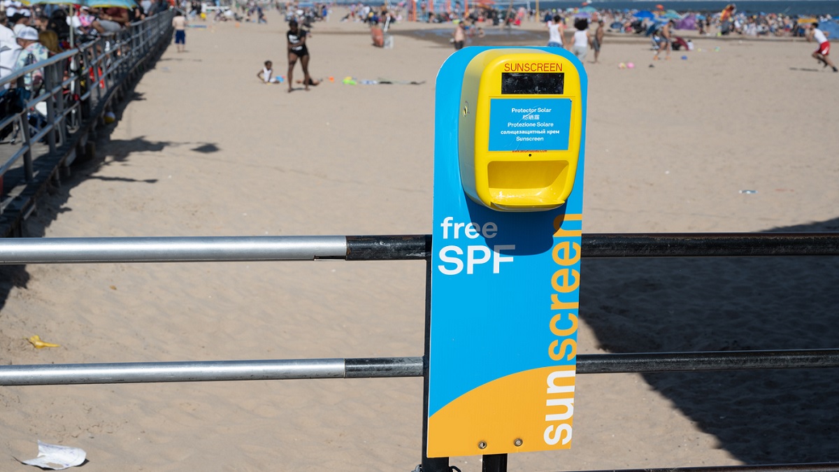 Free sunscreen dispenser on a beach