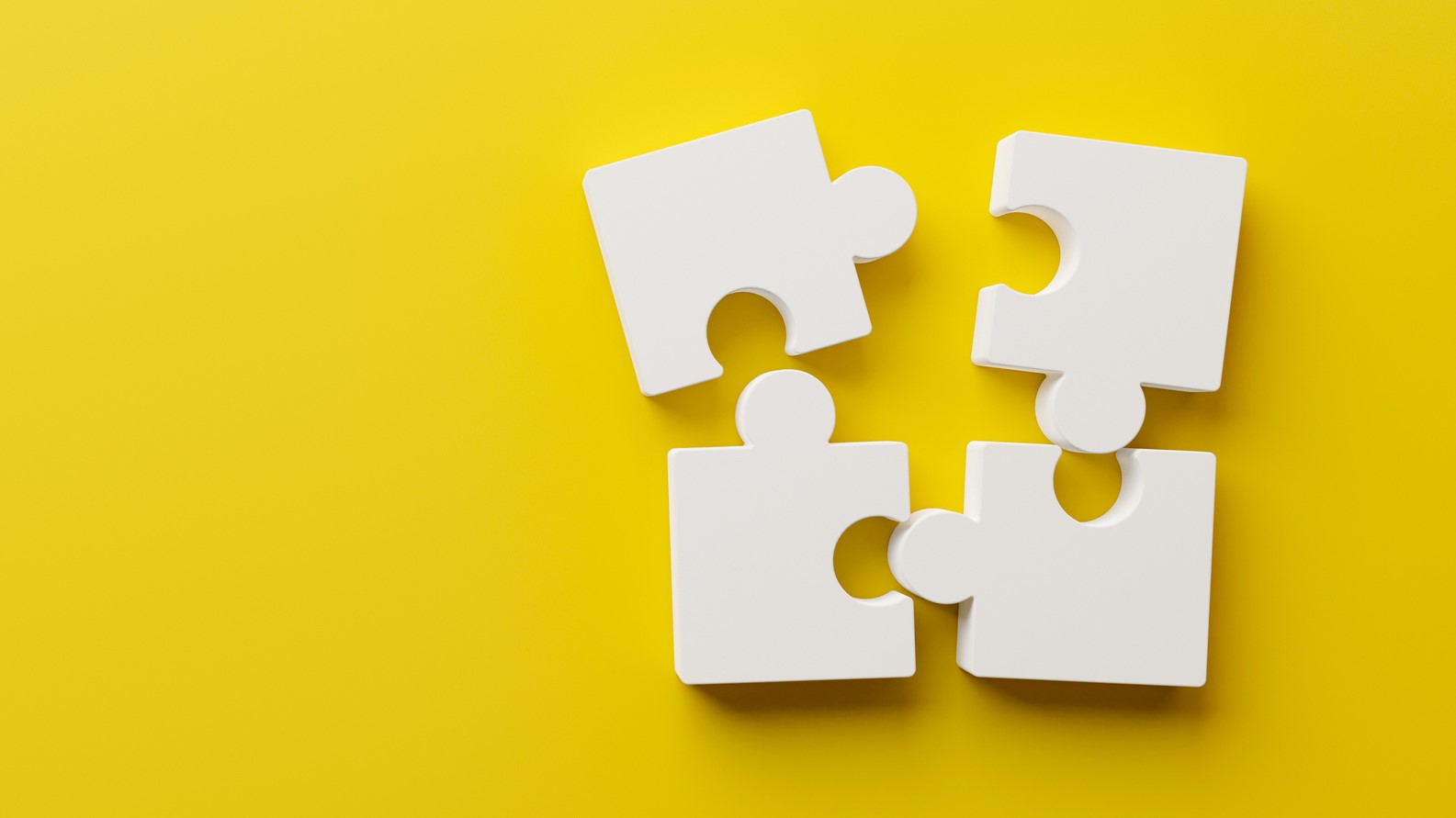— title missing — 4 puzzle pieces almost connecting