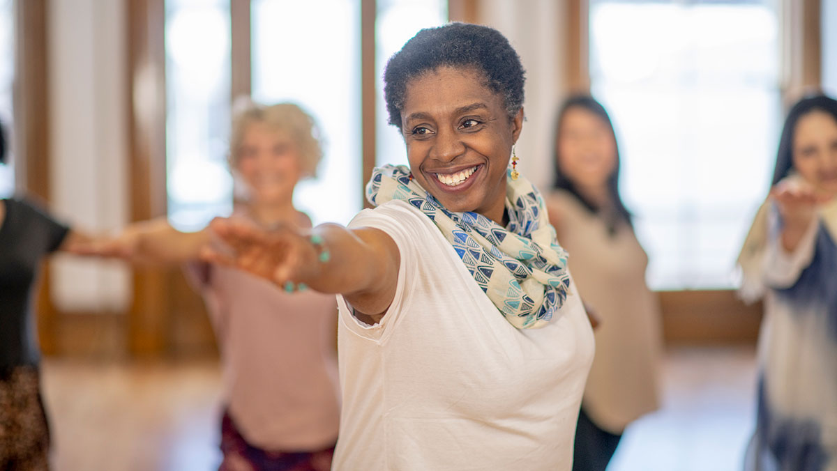 diabetes-prevention-equity smiling woman doing yoga