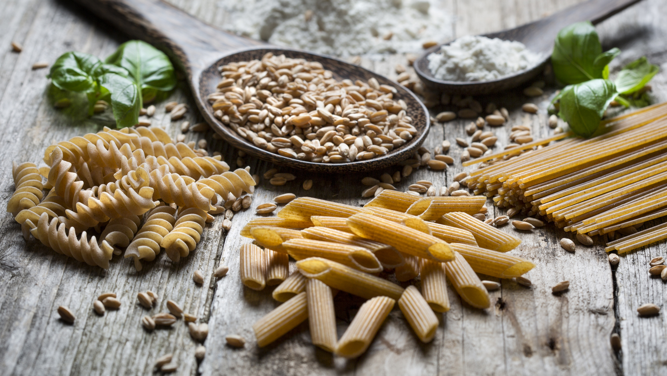 half wheat carbs w/ 16:9 ratio Mixed wheat and white pasta laid out on a table