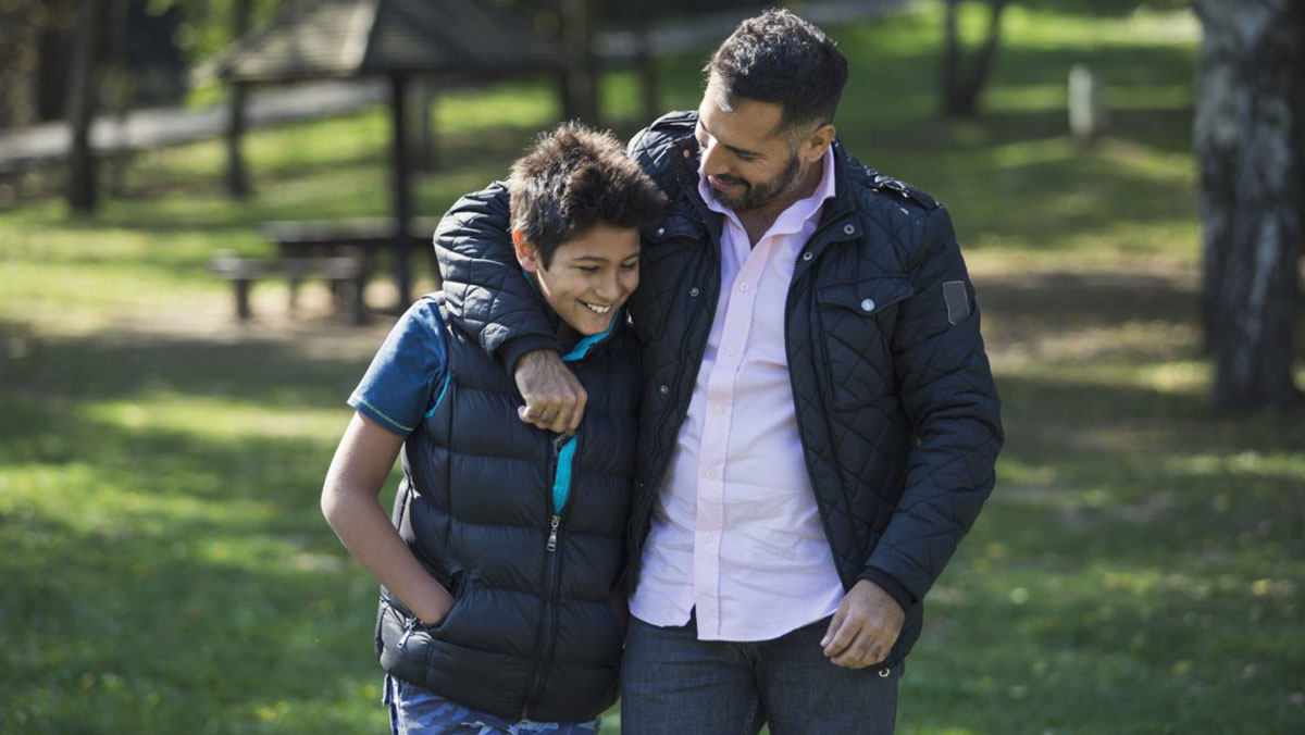 GettyImages925672792abouttype1.jpg man hugging his son