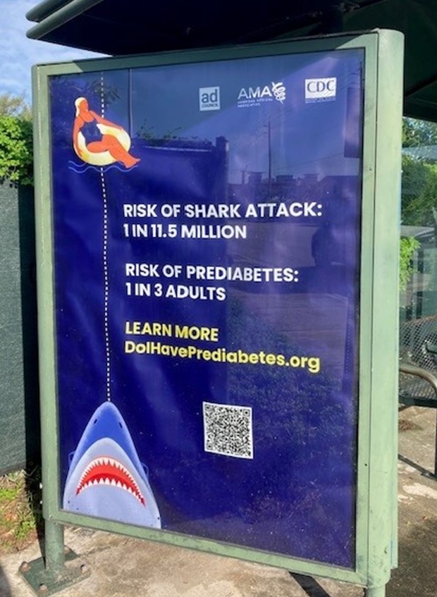 Image of bus stop ad with the text: Risk of shark attack: 1 in 11.5 million. Risk of prediabetes: 1 in 3 adults.