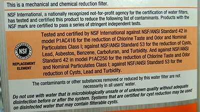 Water filter label with NSF standard Filter label showing a description of NSF standards the product meets. The description says, "Tested and certified by NSF International against NSF/ANSI Standard 42 in model P1AC416 for the reduction of Chlorine Taste and Odor and Nominal Particulates Class I; against NSF/ANSI Standard 53 for the reduction of Cysts, Lead, Asbestos, Benzene, Carbofuran, and Turbidity. And against NSF/ANSI Standard 42 in model P1AC250 for the reduction of Chlorine Taste and Odor and Nominal Particulates Class I; against NSF/ANSI Standard 53 for the reduction of Cysts, Lead and Turbidity.