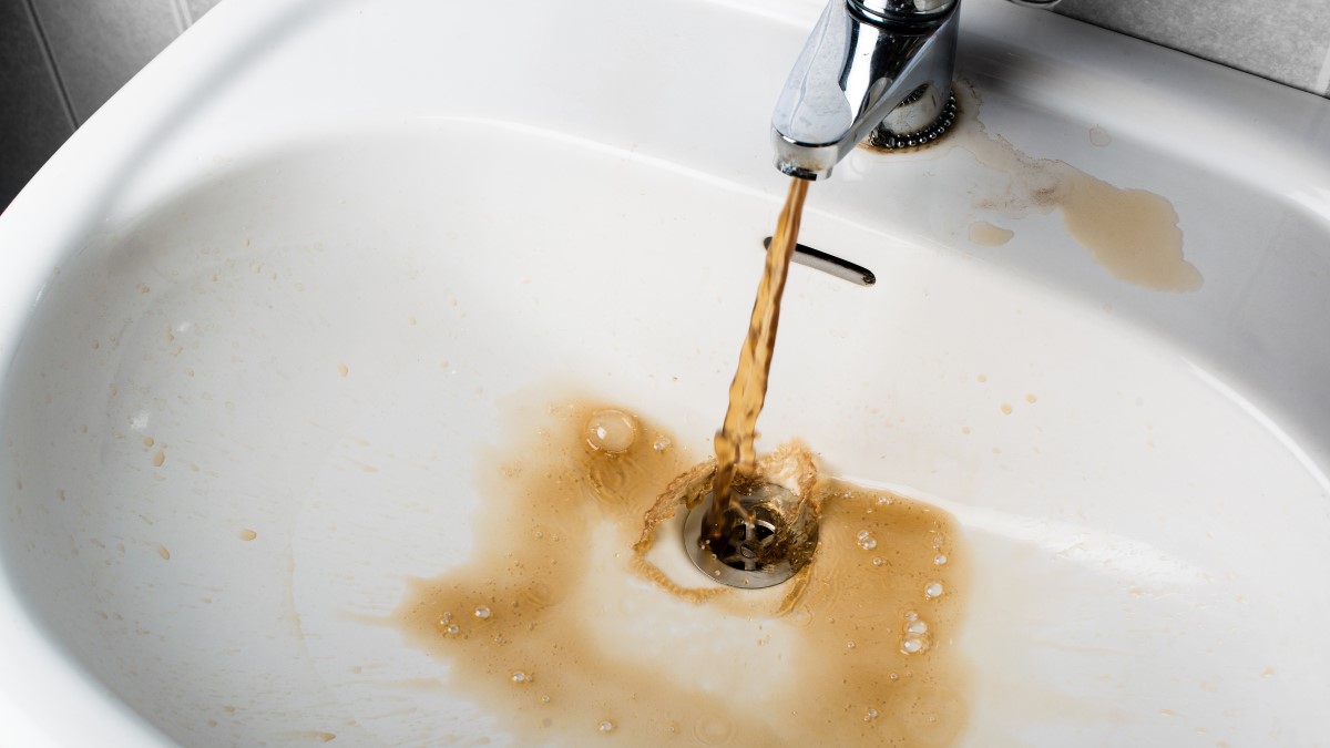 Brown tap water Brown water coming out of a sink faucet