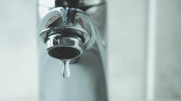 — title missing — Water faucet with a drop of water coming out