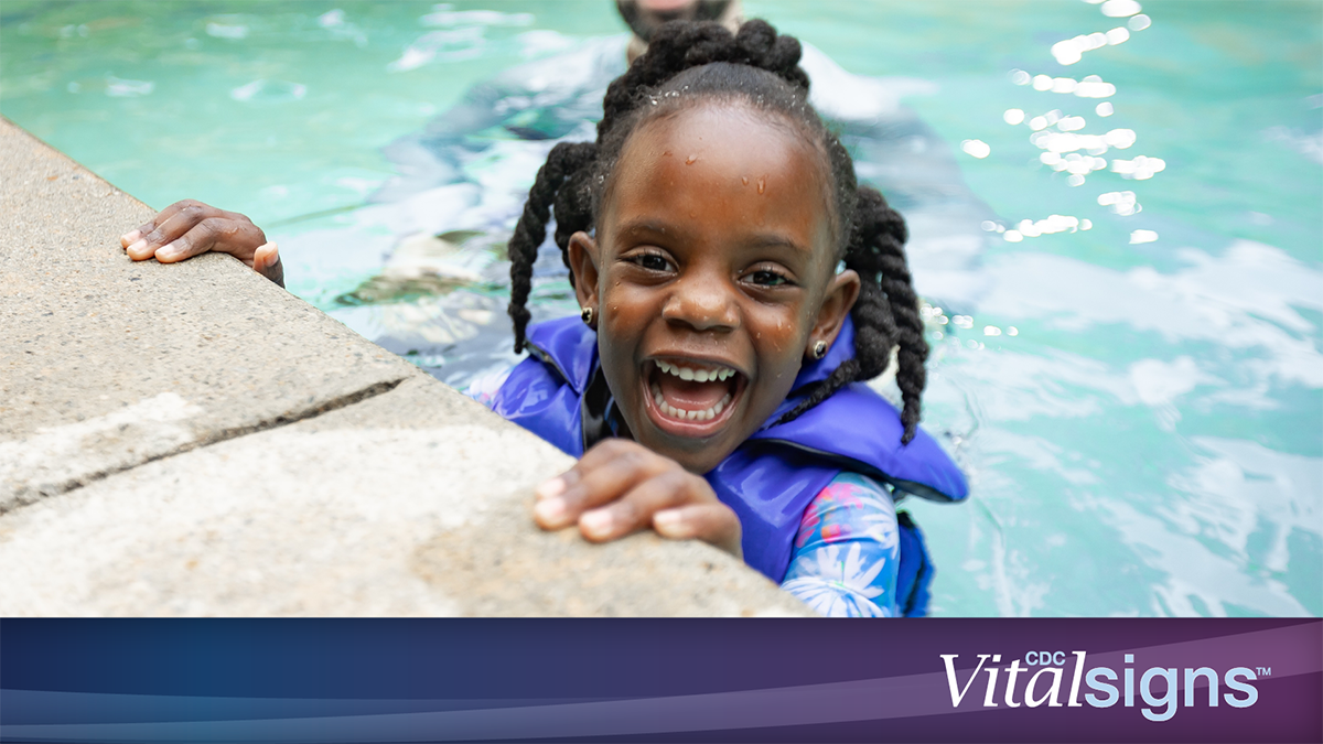 Drowning Vital Signs Girl in life jacket in pool with dad. CDC Vital Signs