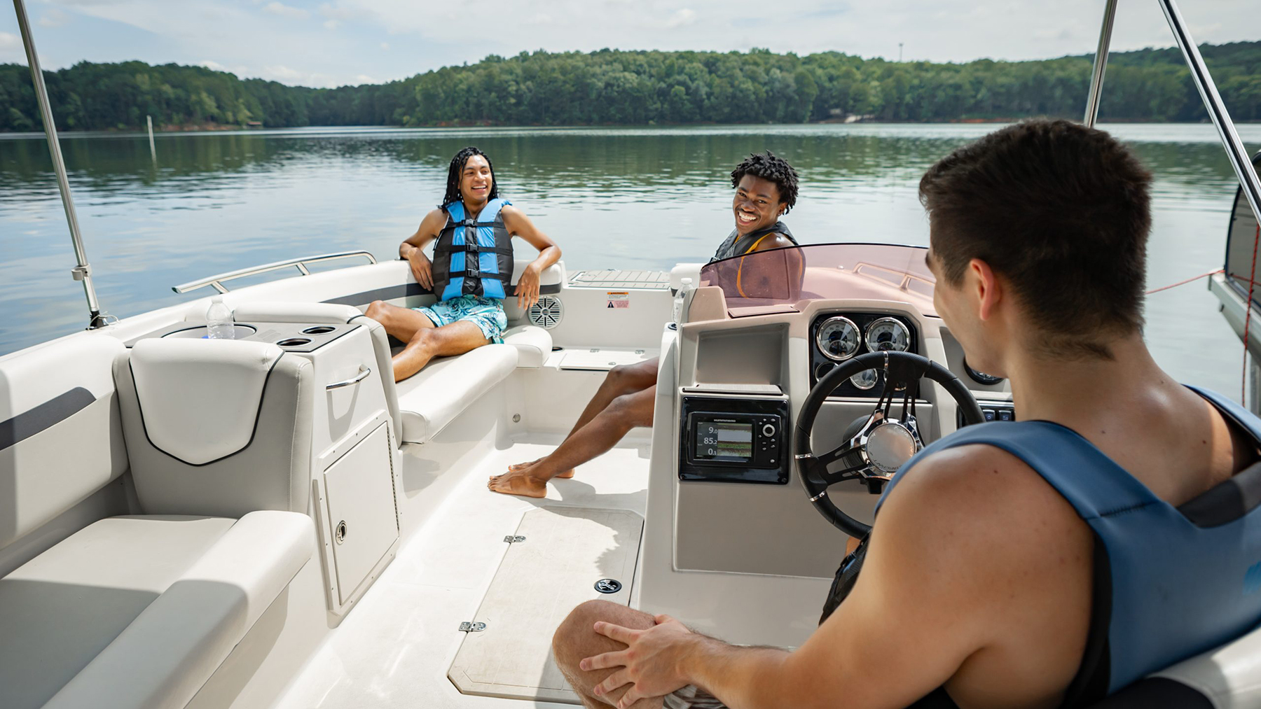 DP535LifeJacketsOnBoatYoungMales.jpg young males with life jackets on boat on lake