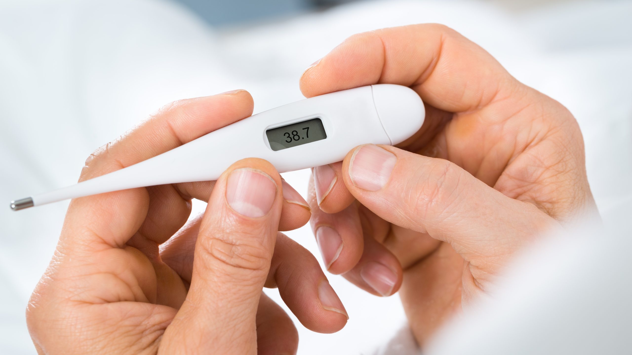thermometer Hands holding a thermometer