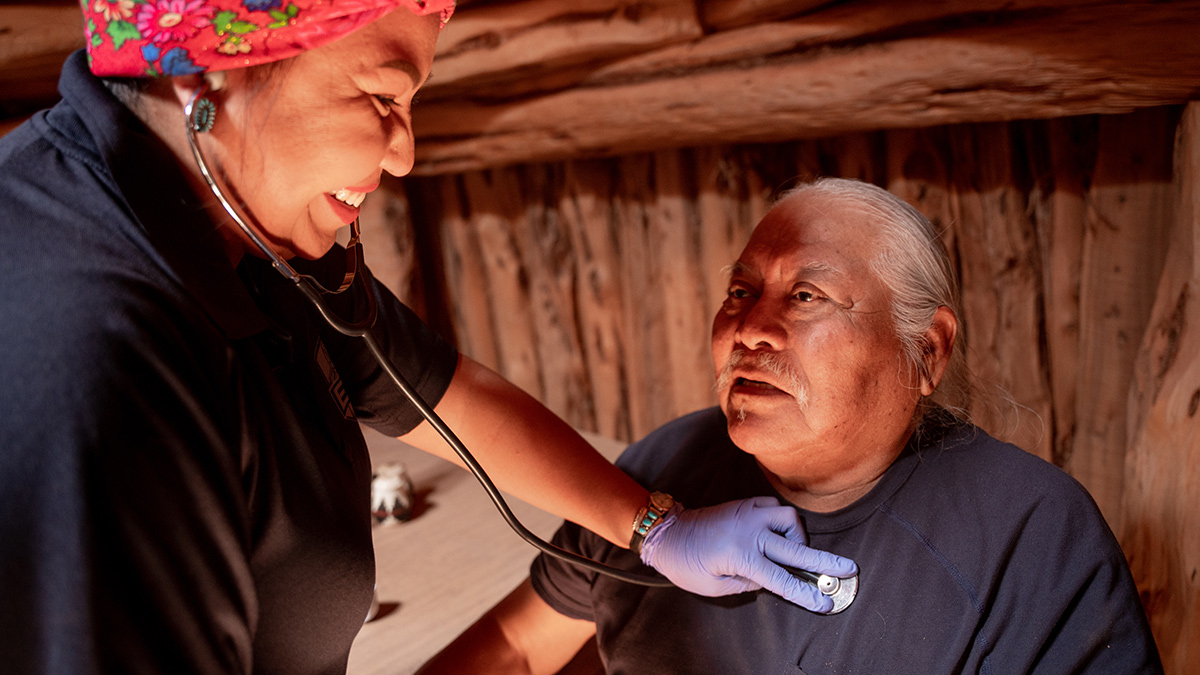 Doctor-patient-stethoscope A healthcare provider uses a stethoscope with a patient