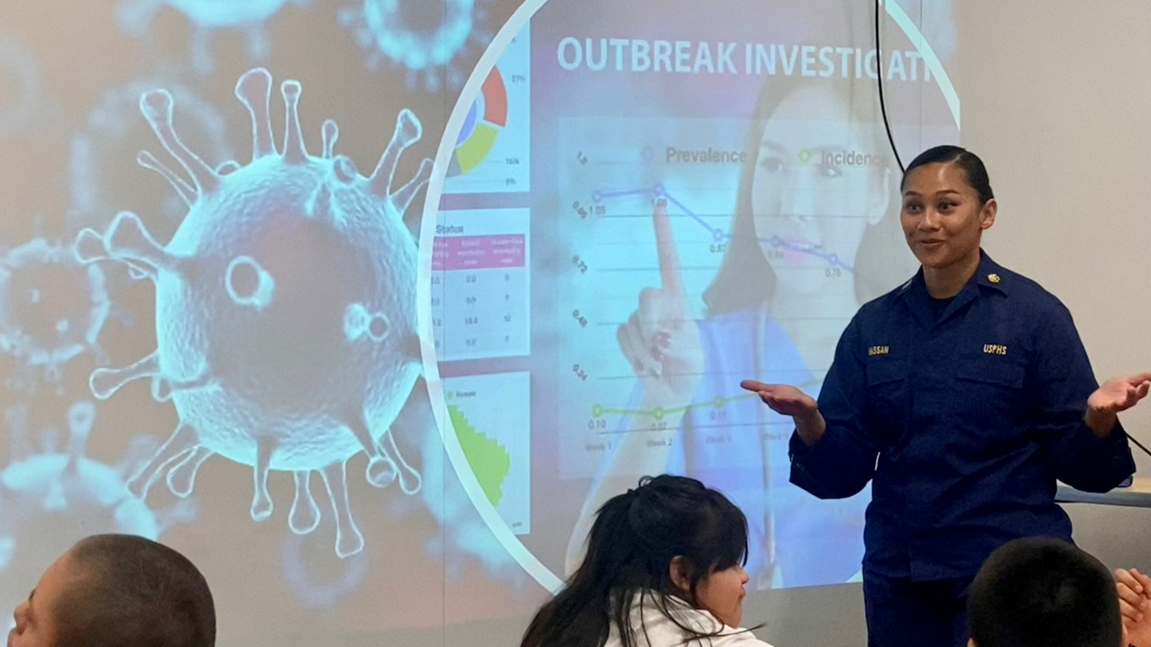 EIS officer (Class of 2024) and Tillman Scholar, LT Adiba Hassan, talking to Pat Tillman Middle School students on being a disease detective for an Arizona Cardinals Salute to Service event.