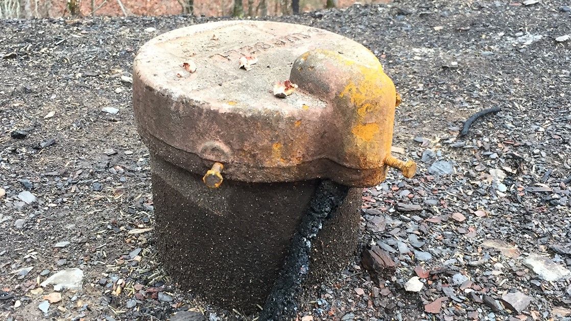 Rapid Assessment Form for Wells After Wildfire A photograph of a charred wellhead.