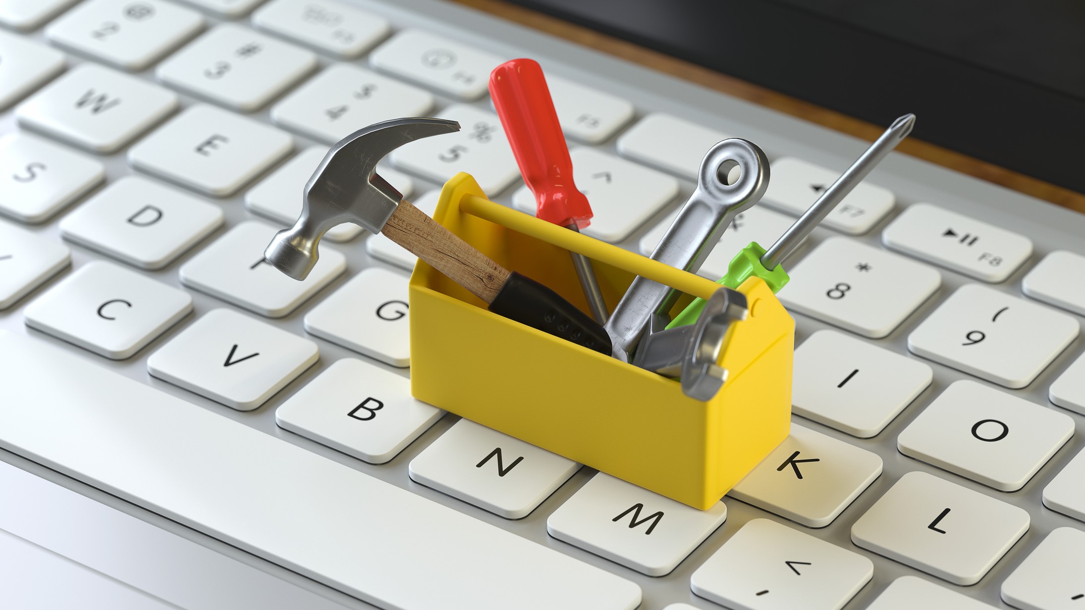 Tools A box of tools on a keyboard.