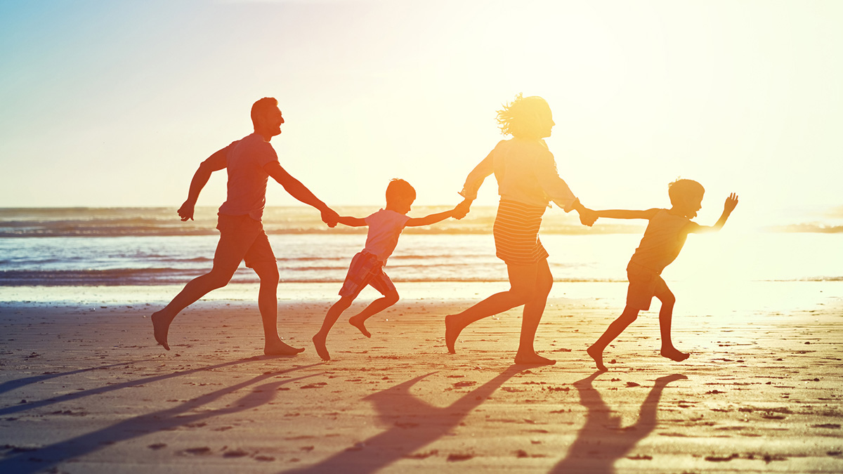 Tracking Data Topics Family of four running on beach at sunset