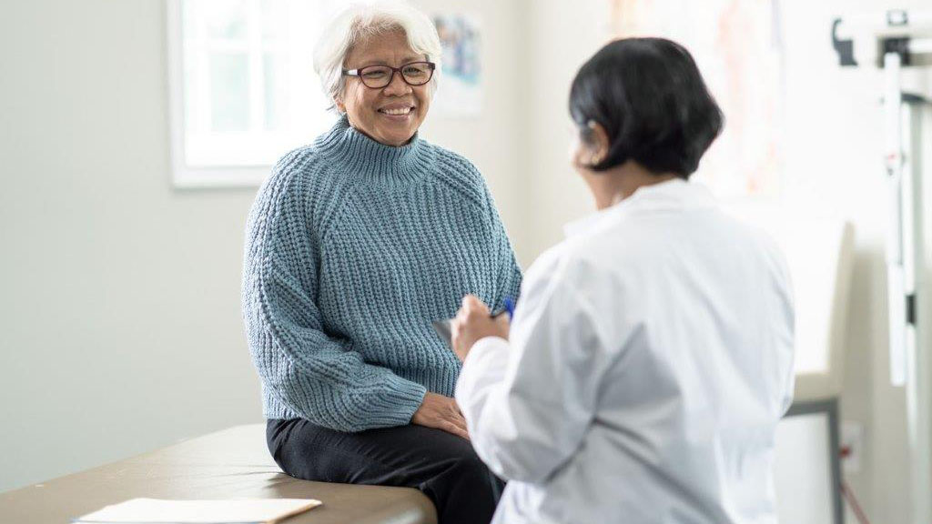 senior-woman-doctor-discussion A woman discusses with doctor