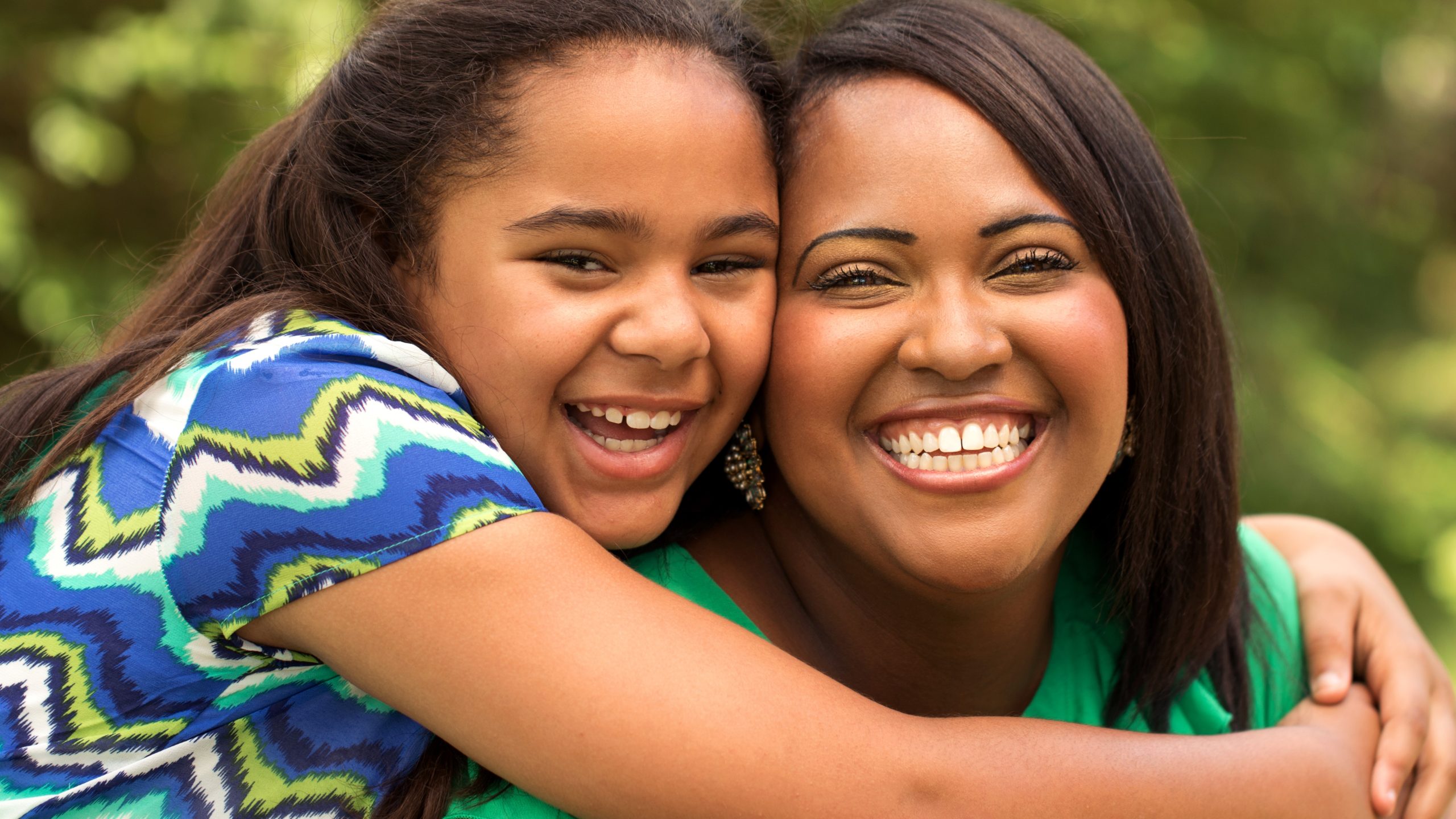 — title missing — Mother and daughter hugging each other.