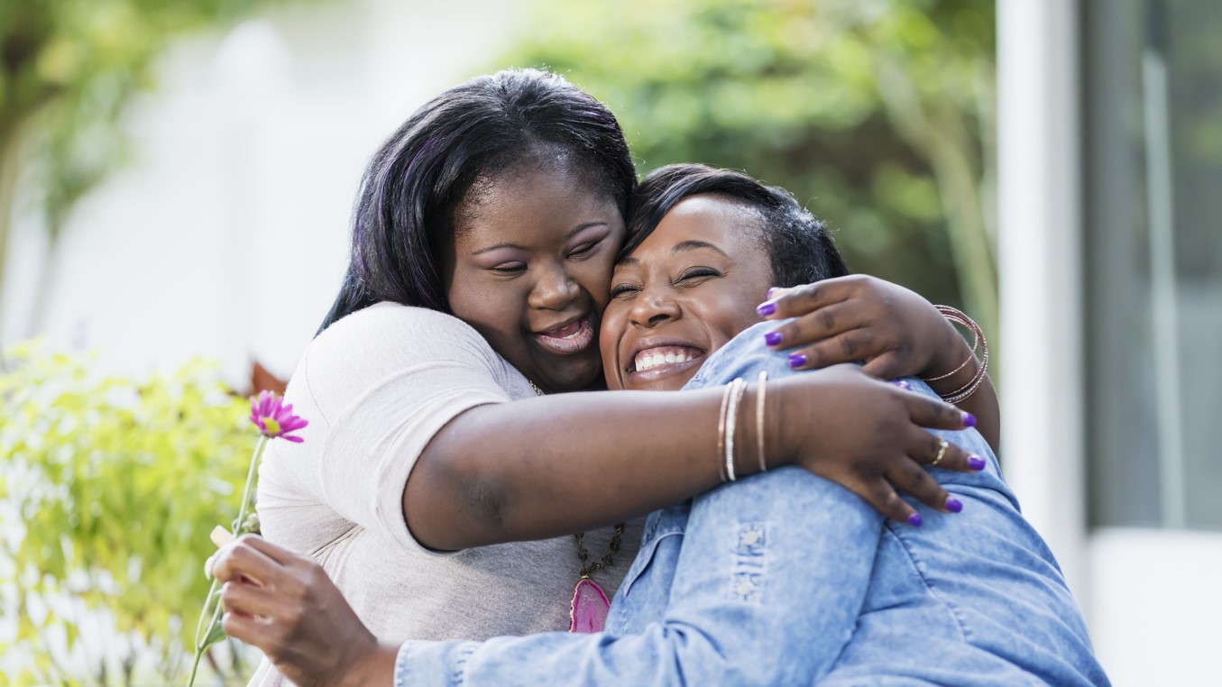 — title missing — Mother and daughter hugging.