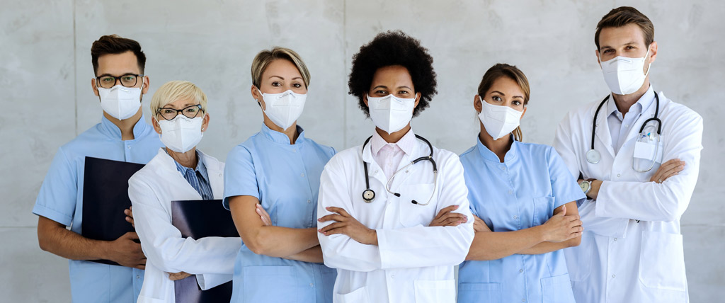team of confident medical experts with protective face masks Learn more about influenza vaccination guidance and recommendations for health care professionals.