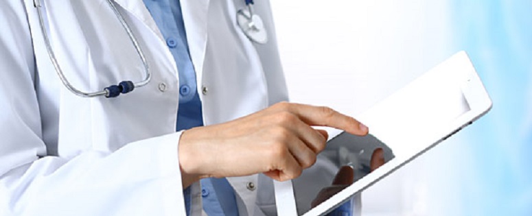 NFID-conf Doctor holding a tablet device.