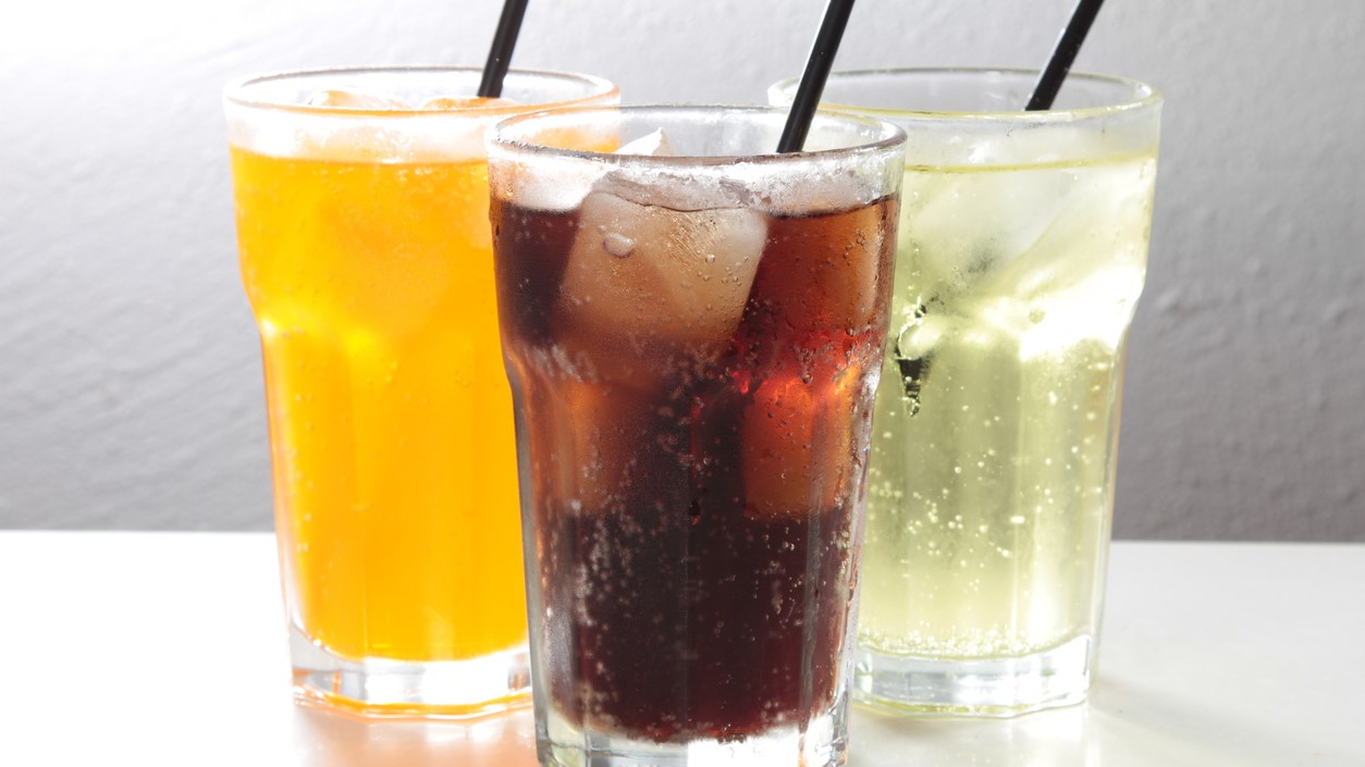 — title missing — Three varieties of soft drinks in glasses.