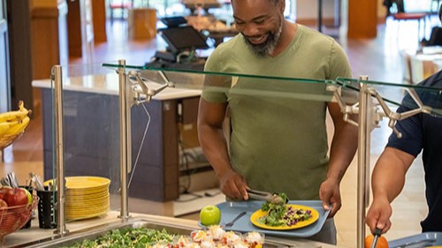 — title missing — Man at a salad bar.