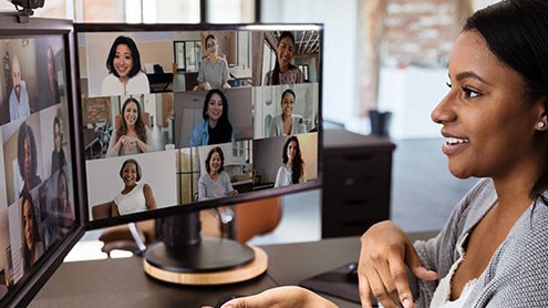 — title missing — Woman having a video conference call with team members.
