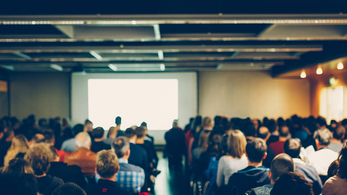 Genomics Seminars Many audience members at seminar listening to a speaker