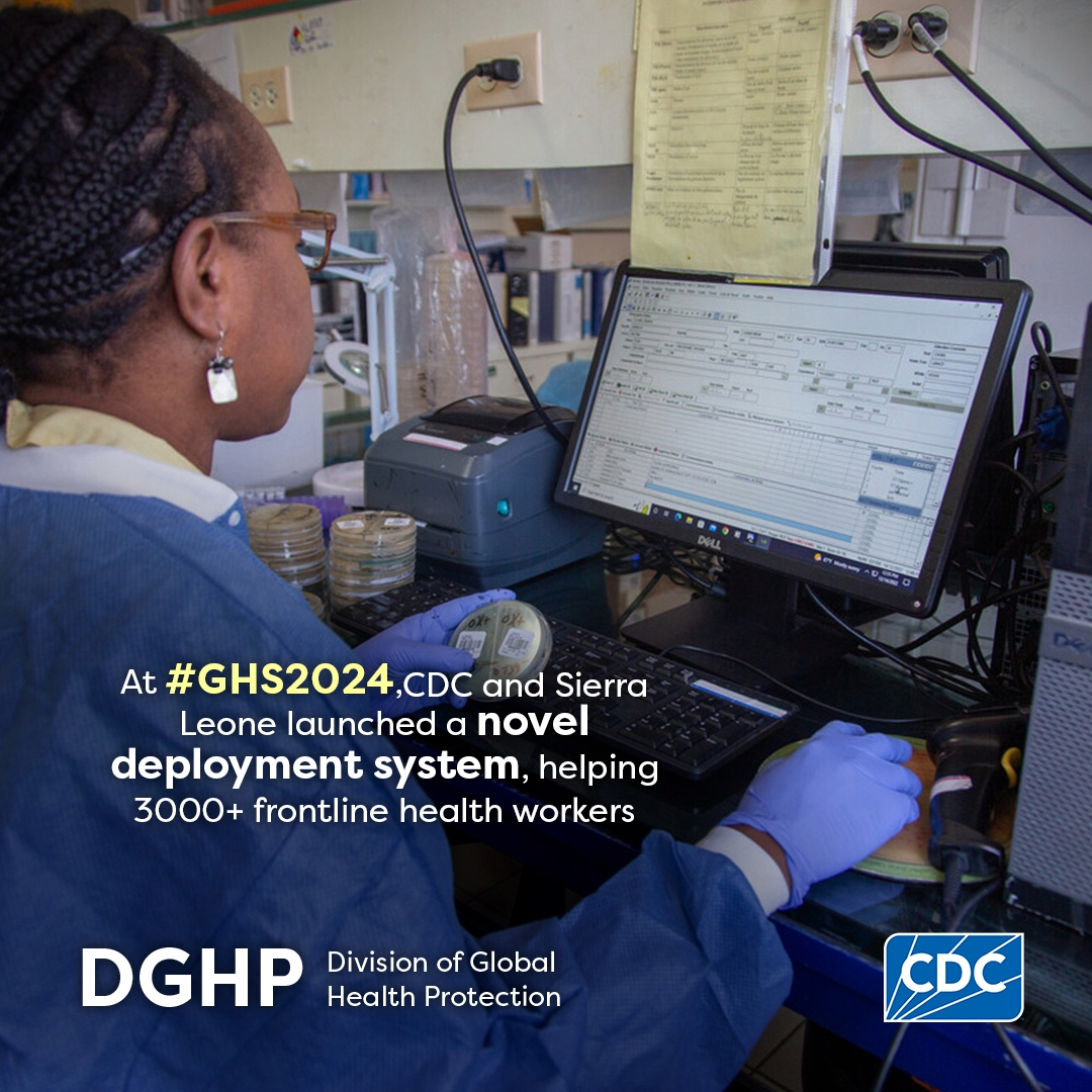 Global Health Security Conference - Sierra Leone Woman entering data. Text: At GHS2024, CDC and Sierra Leone launched a novel deployment system, helping 3000+ front line health workers.