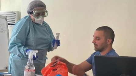 Georgia-RRT-PPE Levan Bakuradze instructing on how to safely wear and remove personal protective equipment and proper methods of sample collection