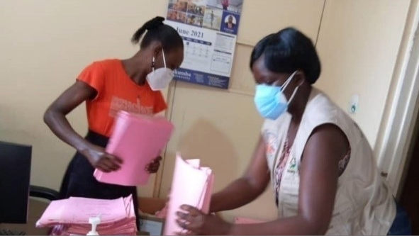 Uganda-FETP-Picture2 Advanced FETP fellow Sarah Elayeete searches for COVID-19 patients records at a Kampala Hospital