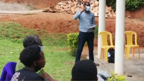 Uganda-FETP-Picture3 Bob Amodan, an Advanced FETP fellow, interviews community members regarding their feelings about the COVID-19 vaccine