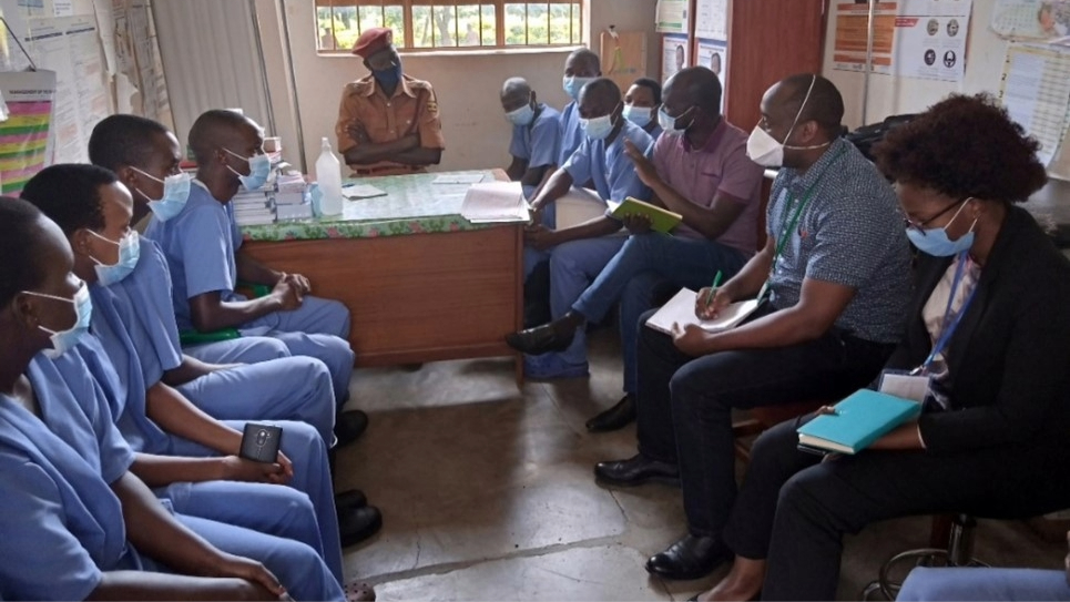 Ugandas_Disease_Detectives_Prison Dr. Richard Migisha and Job Morukileng, and supervisor Claire Biribawa, conduct interviews with healthcare workers
