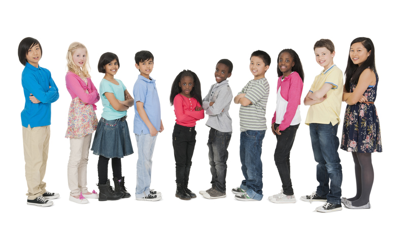 10 children in a line 10 multiethnic children in a line on a white background
