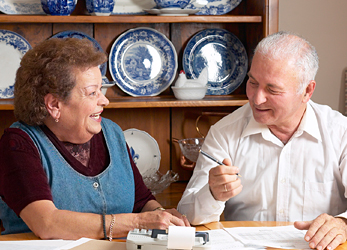 older-adults-bills.jpg Elderly couple reviewing documents.