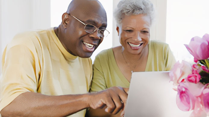 Older couple using computer Two older adults looking at a computer.