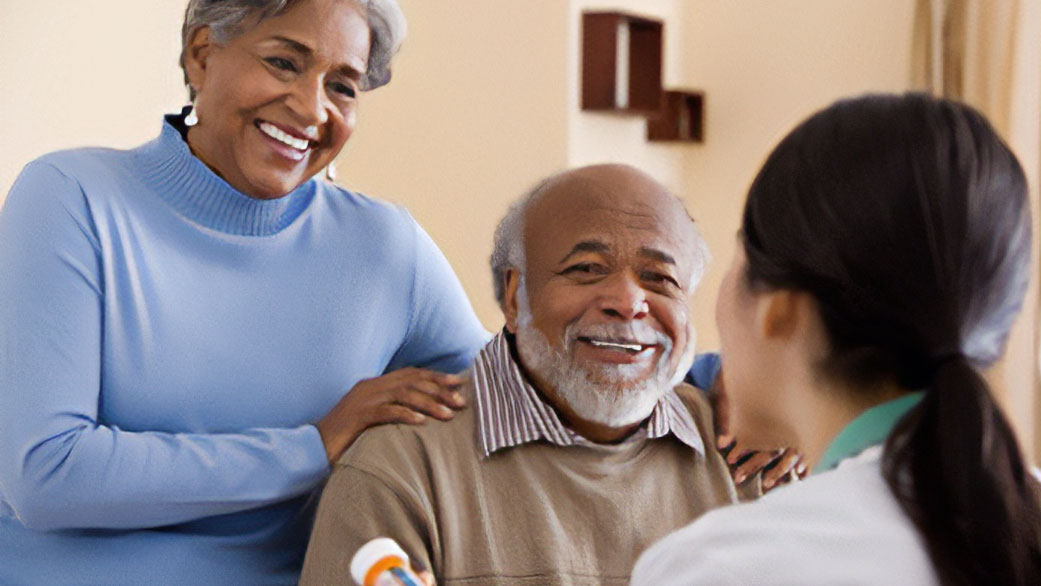 Older adults discussing medication with doctor Older adults being counseled by a health professional.