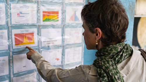 Woman looking at epidemiology data Woman looking at epidemiology data