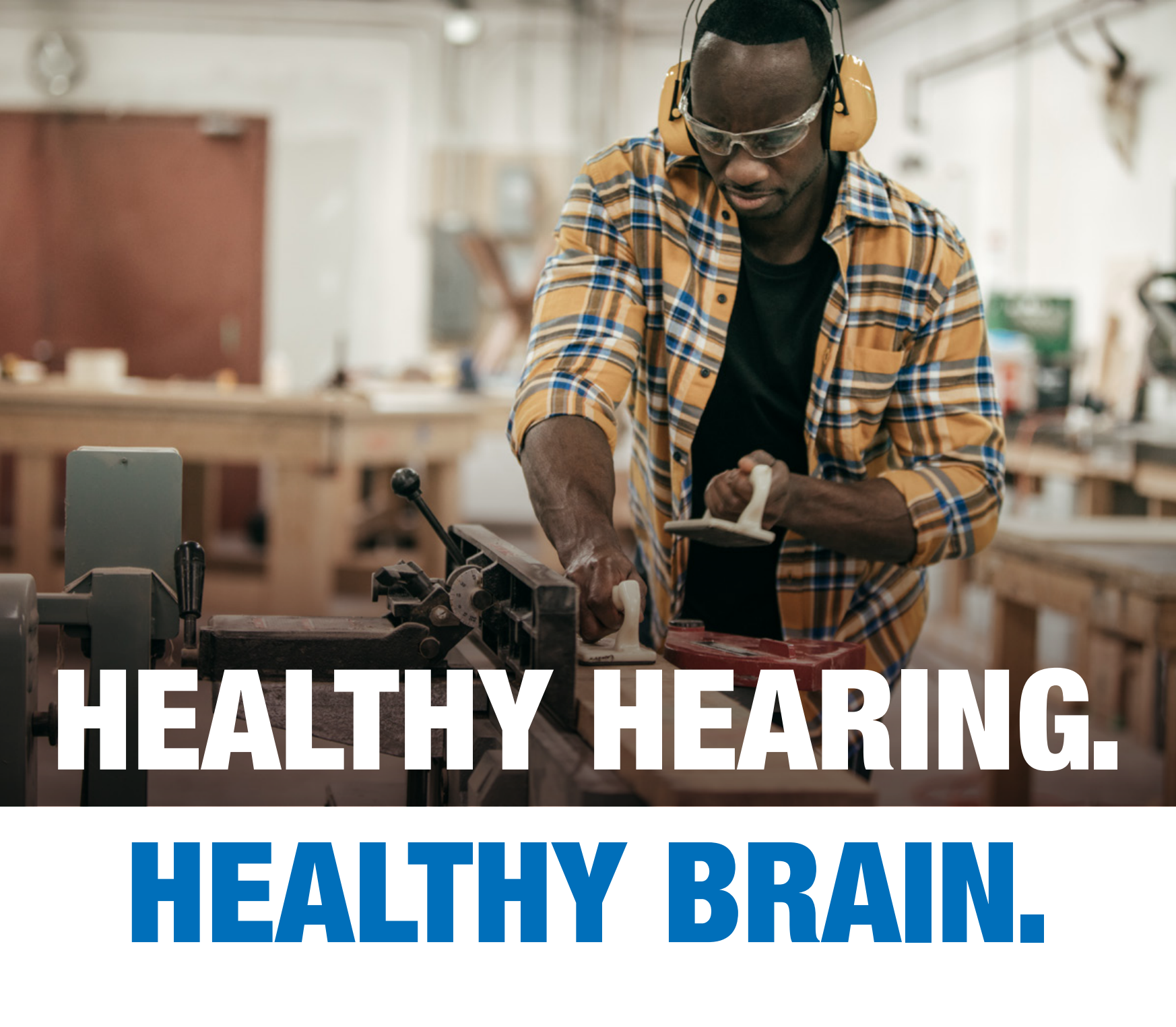 Healthy Hearing. Healthy Brain. African-American man woodworking in a shop. Text: Healthy Hearing. Healthy Brain.